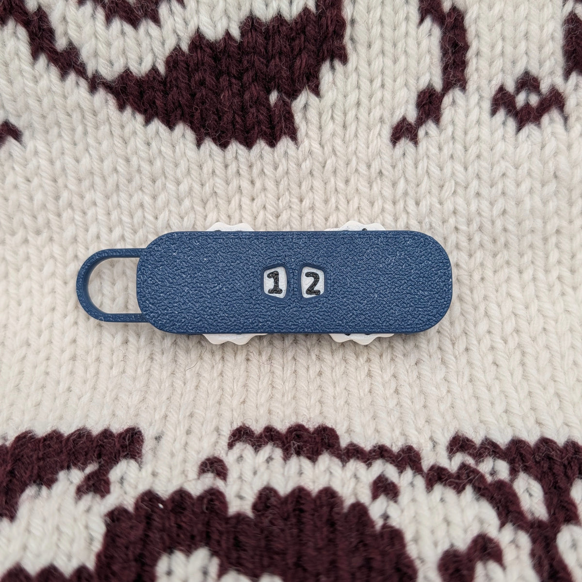 Stitch & Row Counter in Dark Blue on a knit sweater