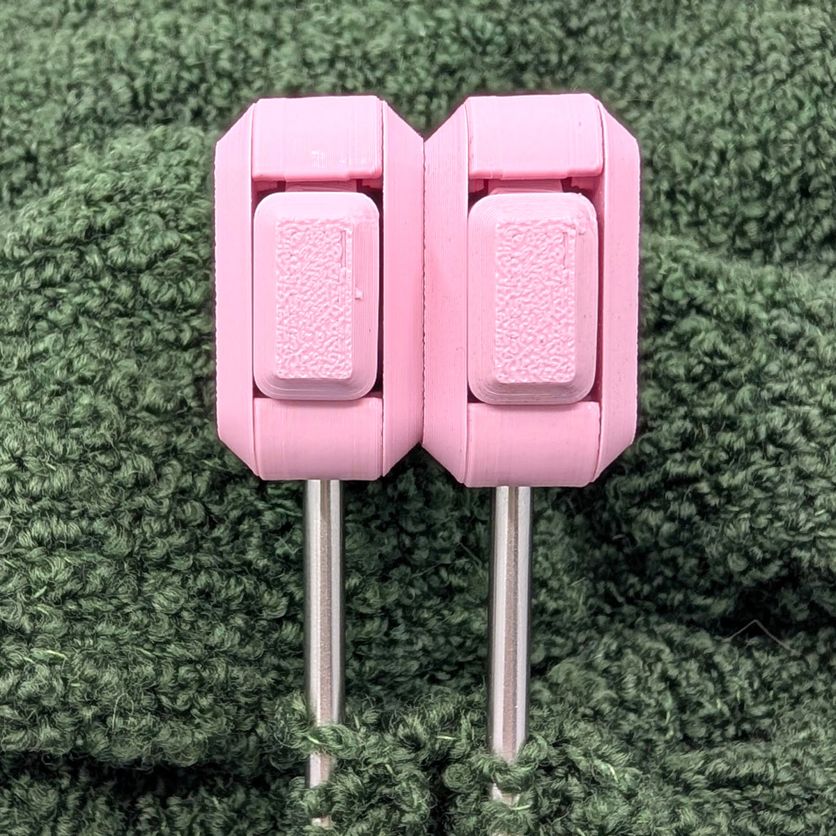 Needle Keepers in Sakura Pink, a pair attached side by side on the needles