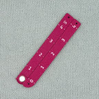 Swatch Gauge in Plum, folded flat, 4 inch side