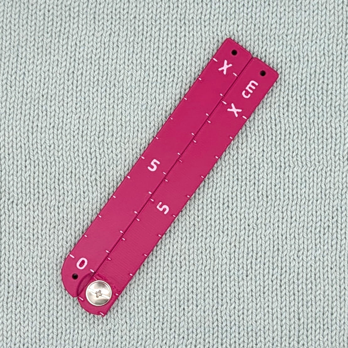 Swatch Gauge in Plum, folded flat, 10 cm side