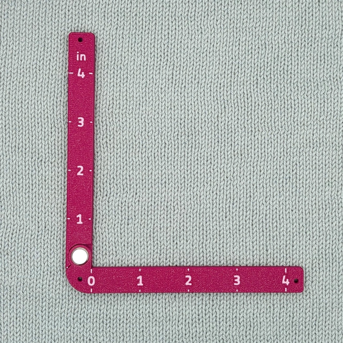 Swatch Gauge in Plum, open to a right angle, 4 inch side