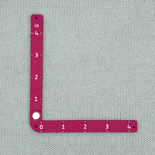 Swatch Gauge in Plum, open to a right angle, 4 inch side