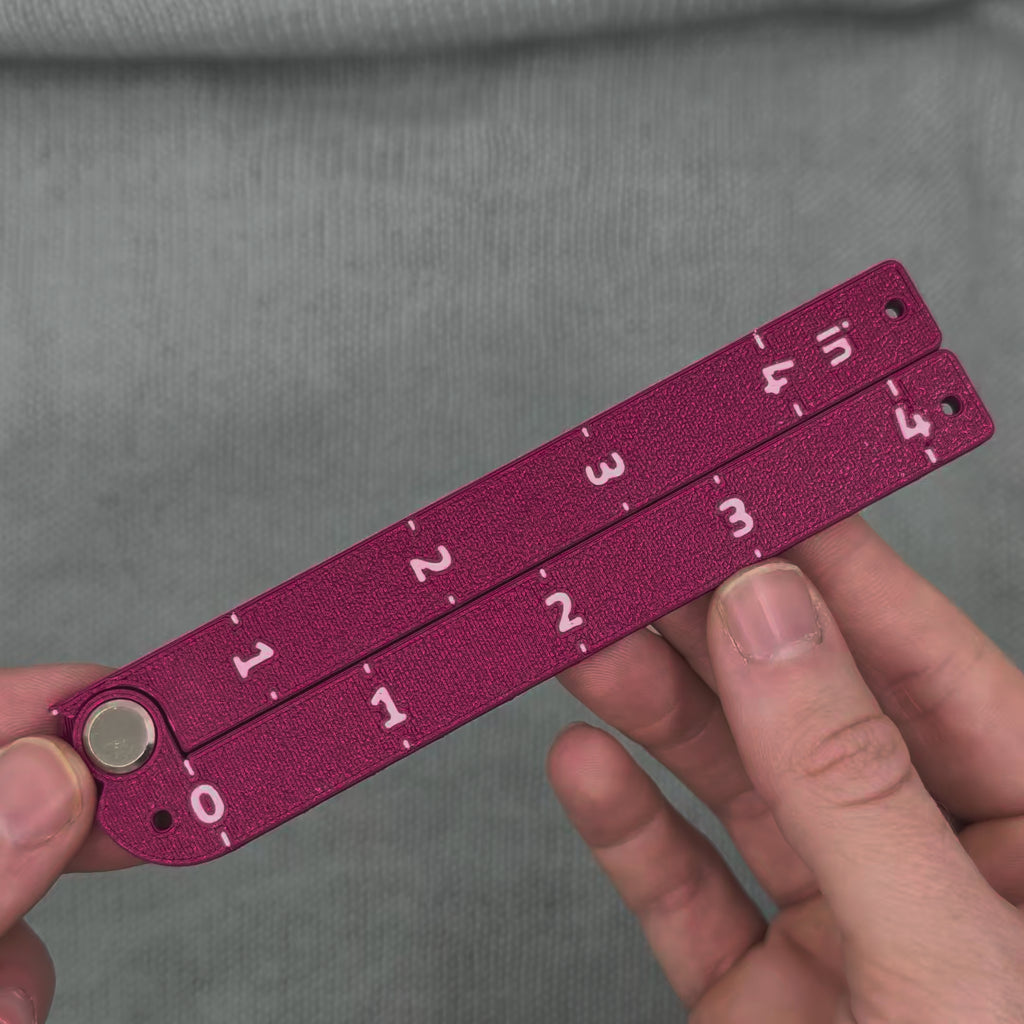 Swatch Gauge in Plum, opening to a right angle and folding flat