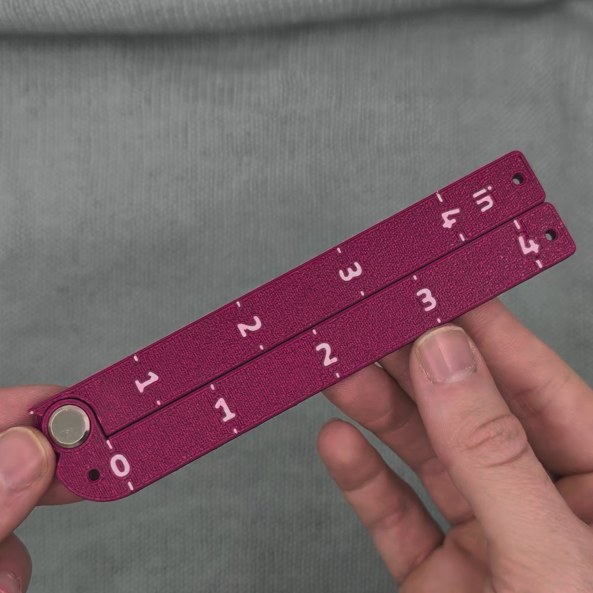 Swatch Gauge in Plum, opening to a right angle and folding flat
